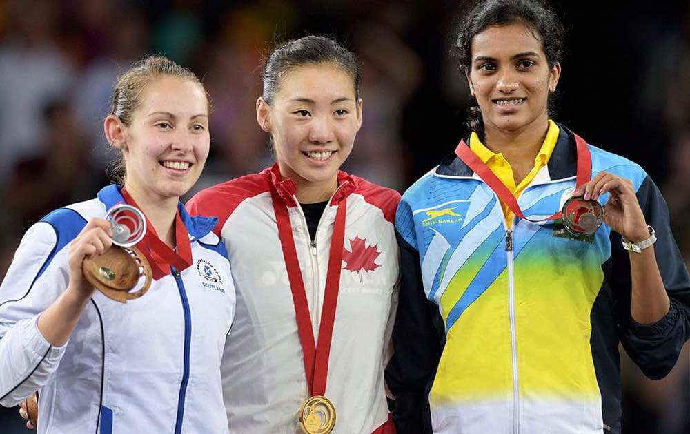 India's Bronze Medallist P V Sindhu, Scotland's Silver medallist Kirsty Gilmour (L) and Canada's Gold medallist Michelle Li after the medal ceremony of Women's Single Badminton final match at Commonwealth Games 2014 in Glasgow, Scotland.