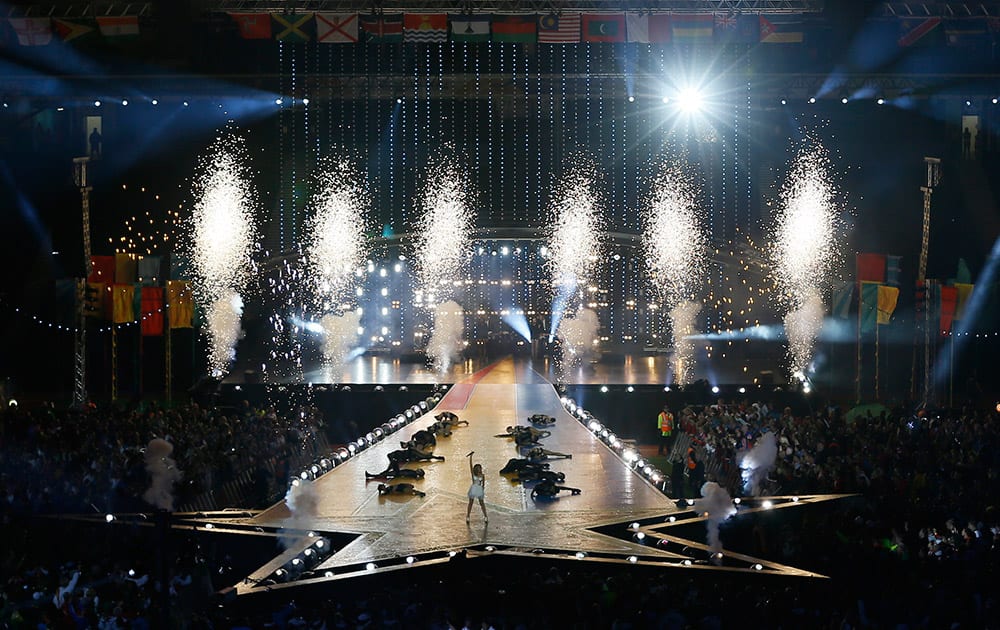 Pyrotechnics explode as Australian pop singer Kylie Minogue performs on stage during the Closing Ceremony for the Commonwealth Games Glasgow 2014, at Hampden Park stadium, in Glasgow, Scotland.