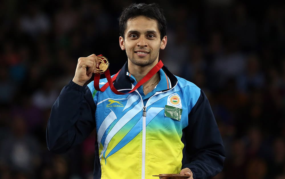 India's Kashyap Parupalli poses with his gold medal after his victory over Singapore's Derek Wong at the end of their men's single's Badminton match at the Emirates Arena during the Commonwealth Games Glasgow 2014.