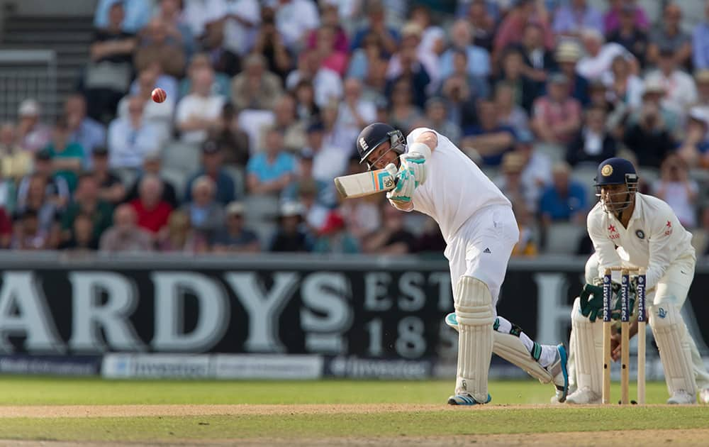 England's Ian Bell hits a 6 off the bowling of India's Ravichandran Ashwin as his side chase an Indian total of 152 at Old Trafford cricket ground on the first day of the fourth test match of their five match series, in Manchester, England.