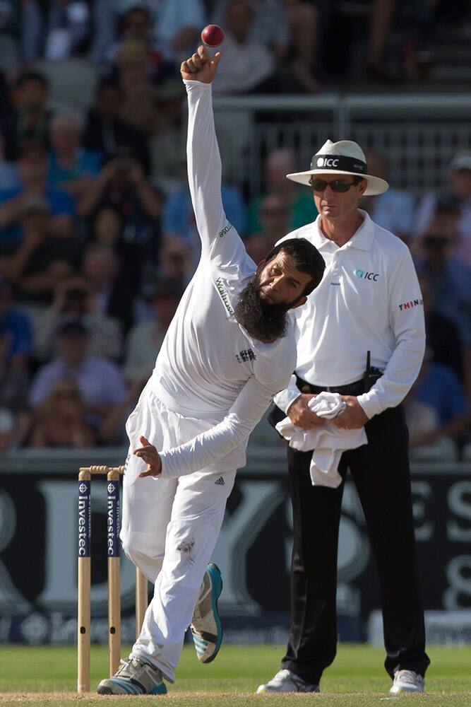 England's Moeen Ali bowls against India at Old Trafford cricket ground on the third day of the fourth test match of their five match series against England, in Manchester, England.