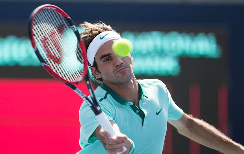 Switzerland`s Roger Federer plays a shot on his way to losing 5-7 6-7 to France`s Jo-Wilfried Tsonga during the Men`s Rogers Cup Singles final.