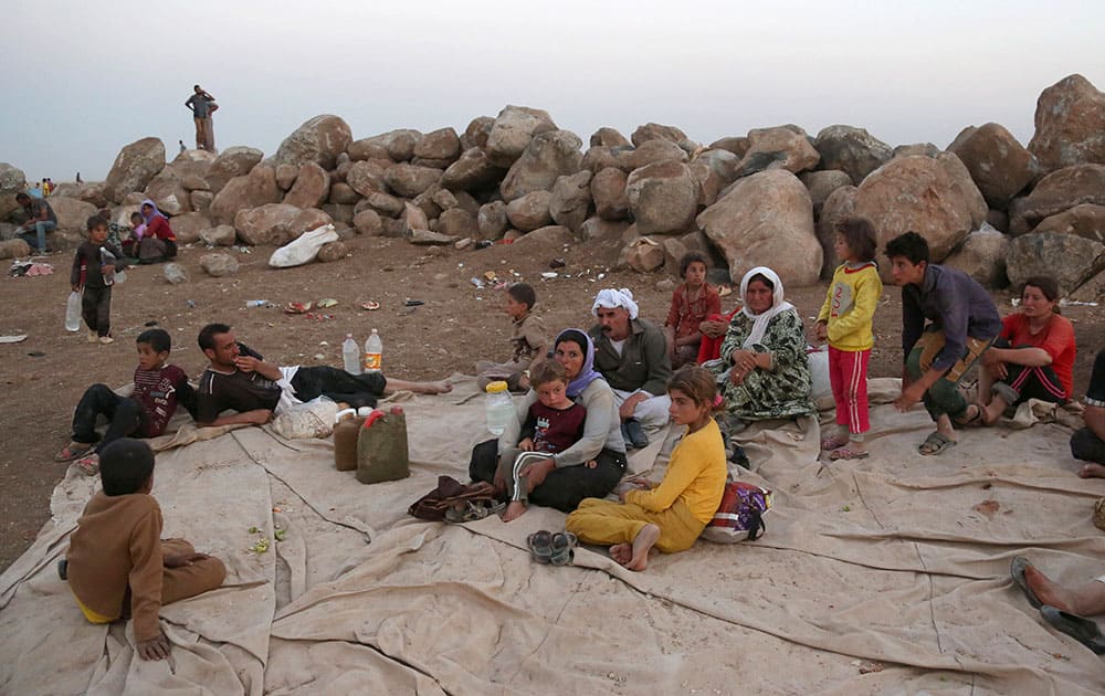 Displaced Iraqis from the Yazidi community settle at a camp in Derike, Syria.