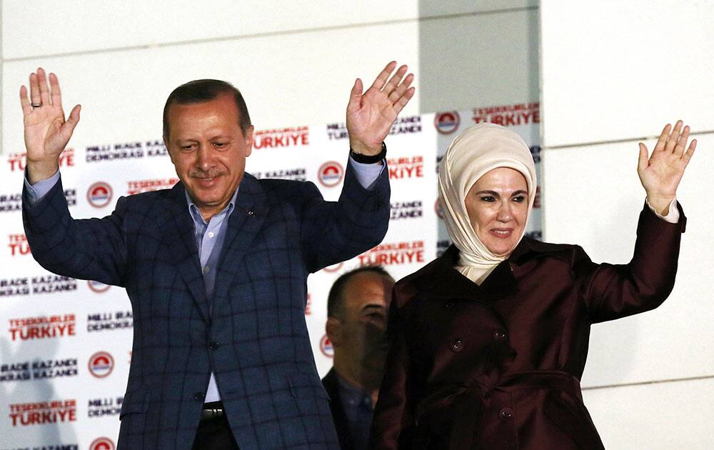 Turkish Prime Minister Recep Tayyip Erdogan and his wife Emine Erdogan acknowledge supporters after Erdogan`s election victory, in Ankara, Turkey.