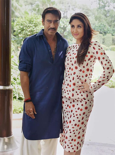 Kareena Kapoor and Ajay Devgn posing during a promotional event of their film.