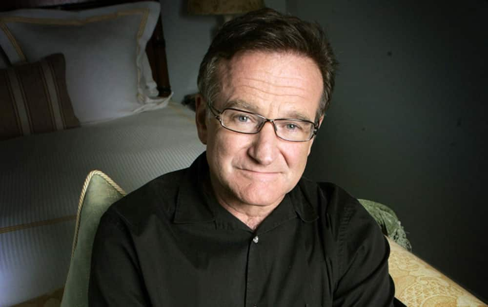 FILE - This June 15, 2007 file photo shows actor and comedian Robin Williams posing for a photo in Santa Monica, Calif. Williams, whose free-form comedy and adept impressions dazzled audiences for decades, died Monday, Aug. 11, 2014, in an apparent suicide. Williams was 63.