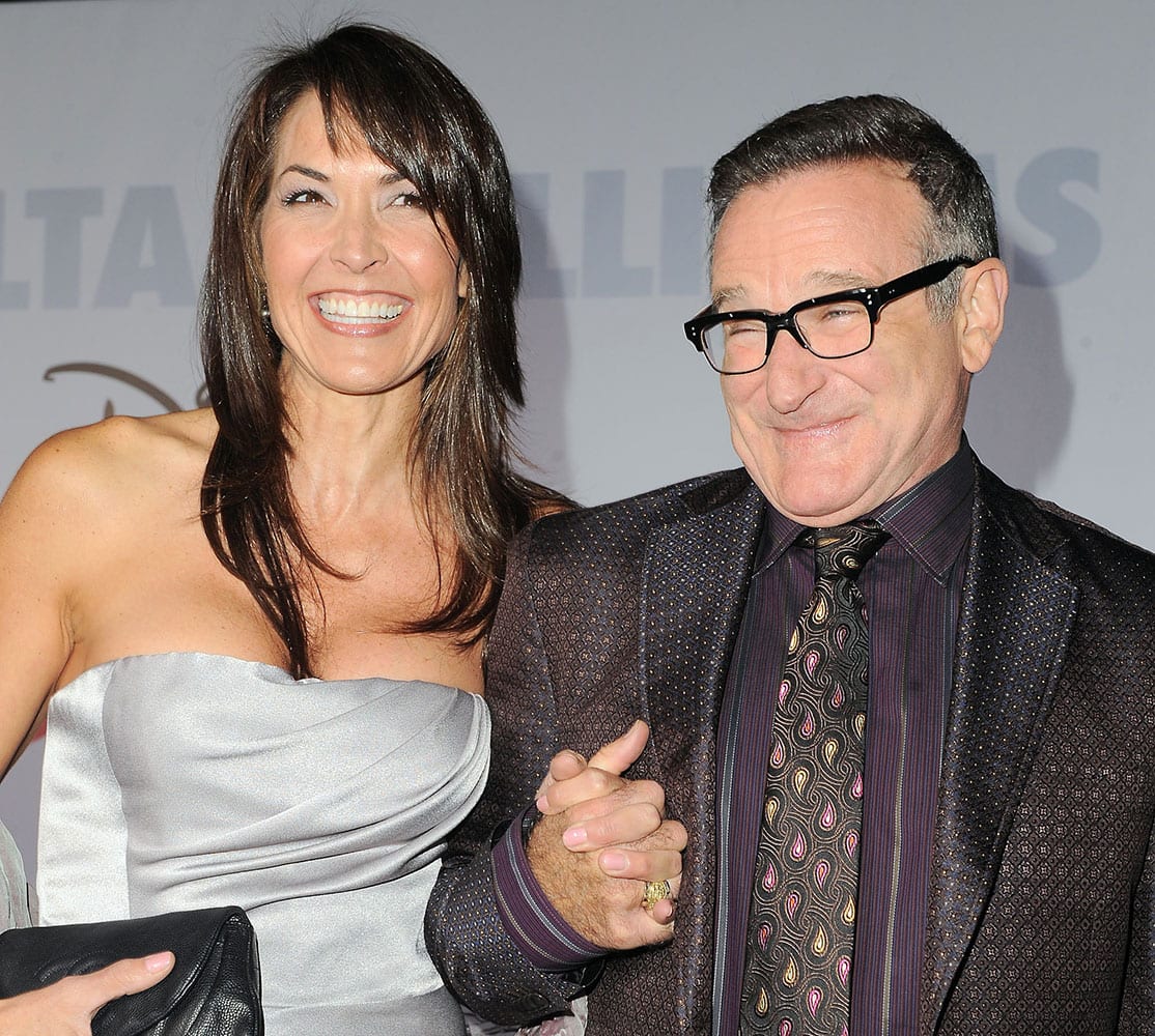 FILE - This Nov. 9, 2009 file photo shows actor Robin Williams, right, and his wife Susan Schneider at the premiere of `Old Dogs` in Los Angeles. Williams, whose free-form comedy and adept impressions dazzled audiences for decades, died Monday, Aug. 11, 2014, in an apparent suicide. 