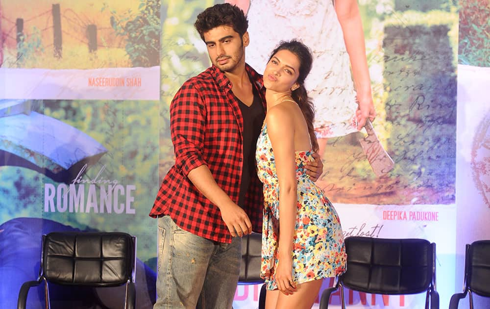 Arjun and Deepika strike a funny pose during the promotion of their film 'Finding Fanny' at Novatel, Juhu in Mumbai. dna