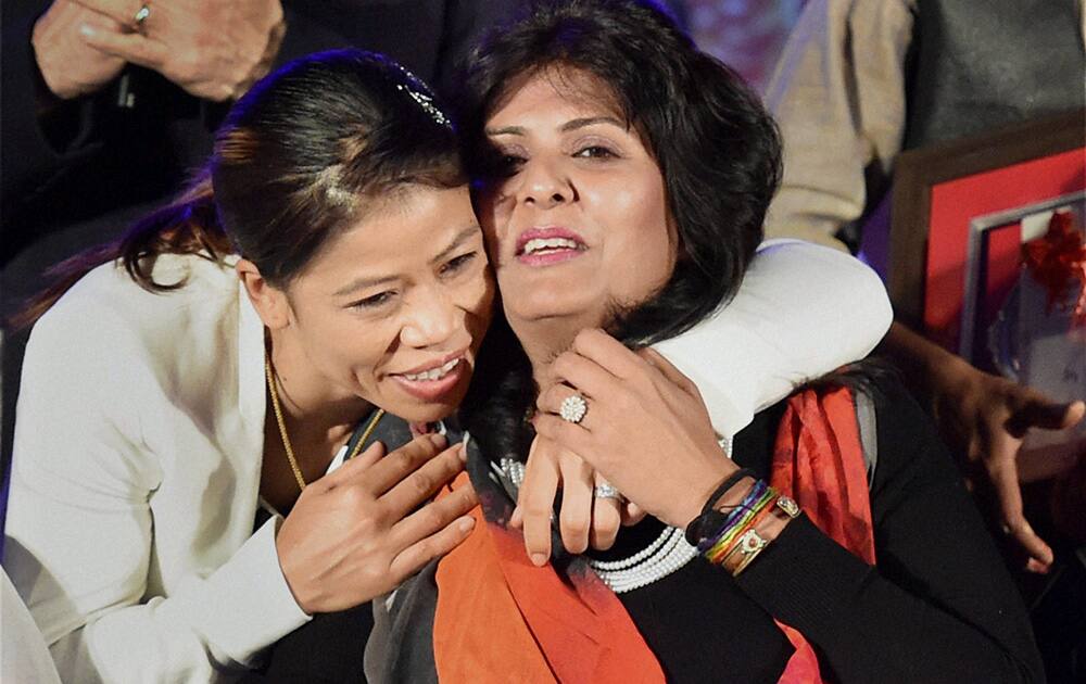 World champion Boxer MC Mary Kom felicitated paralympics athlete Deepa Malik during the promotion of Sanjay Leela Bhansali's forthcoming film Mary Kom, in Mumbai.