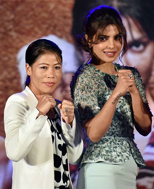 Bollywood actress Priyanka Chopra with World Champion Boxer MC Mary Kom during the promotion of Sanjay Leela Bhansali's forthcoming film Mary Kom, in Mumbai.