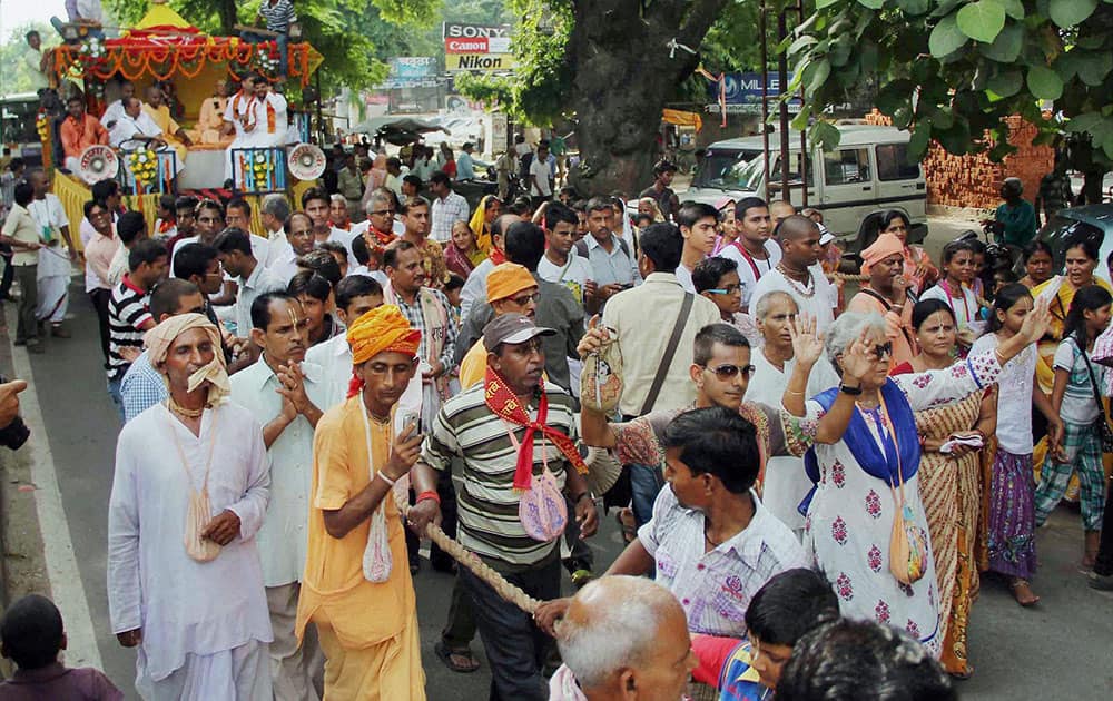 Hindu devotees take part in a religious procession during Shri Krishna Janmashtami celebrations in Allahabad.