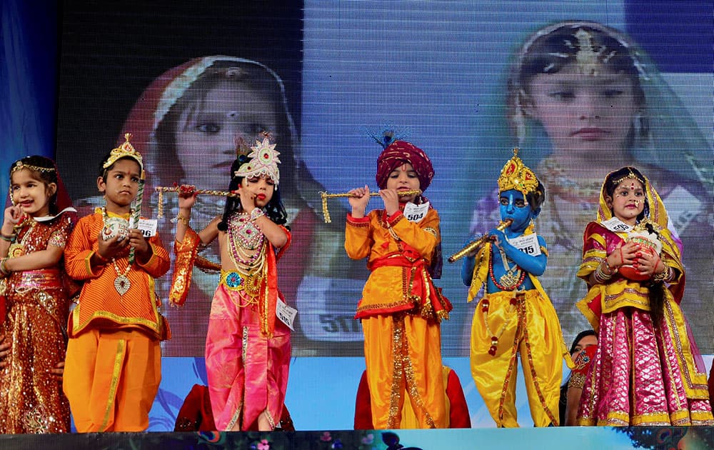 A CHILD DRESSED UP AS LORD KRISHNA AND RADHA PARTICIPATE IN `BAL GOPAL` CONTEST ON THE OCCASION OF JANAMASHTAMI FESTIVAL IN JAIPUR.