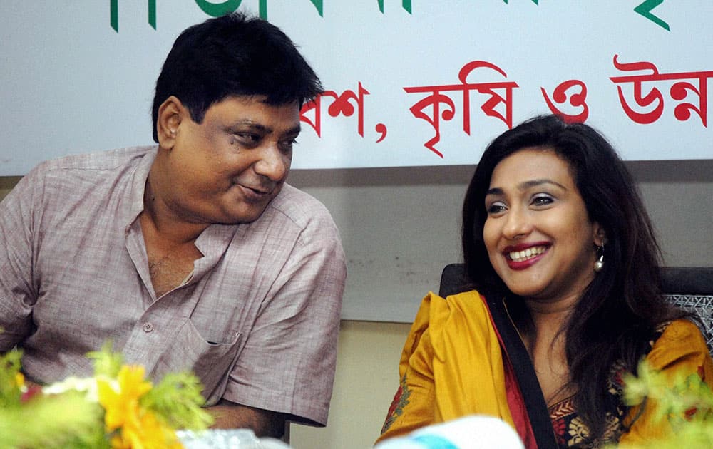 Bollywood actress Rituparna Sengupta with noted lyricist Gautam Susmit (L) at a programme in Kolkata.