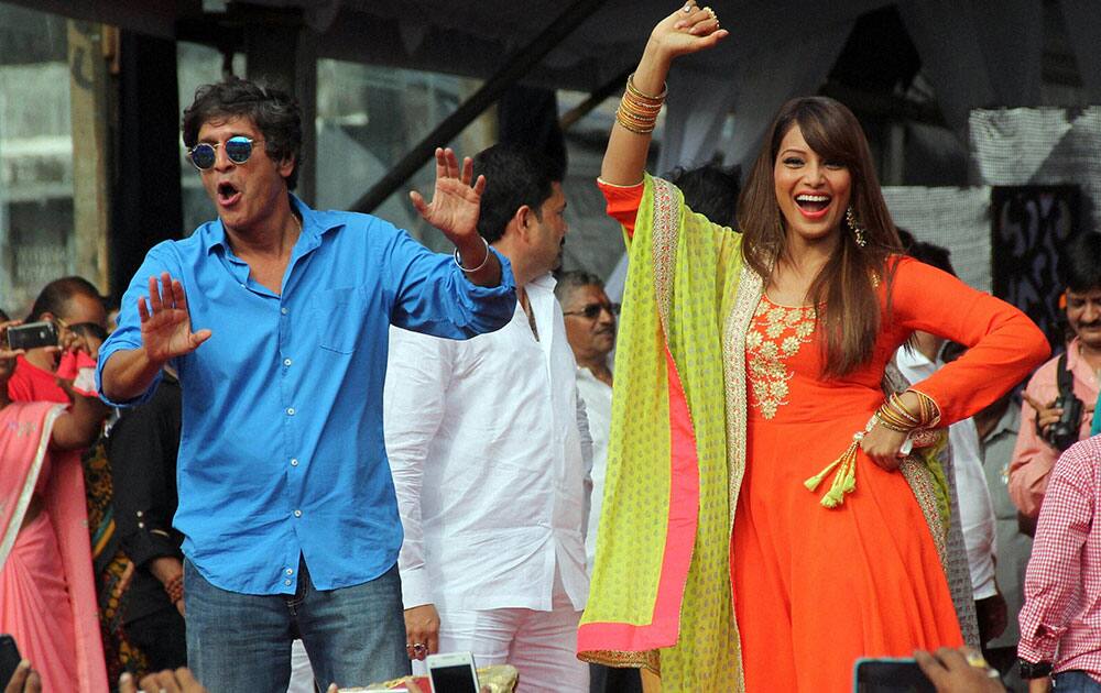 Bollywood actors Chunky pandey and Bipasha Basu perform during the Janmashtami celebrations in Mumbai.