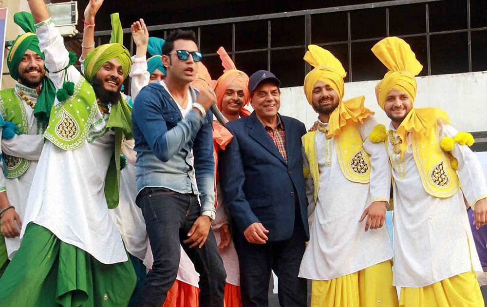 Bollywood actor Dharmendra & Punjabi actor Gippy Grewal at a promotional event for punjabi film.