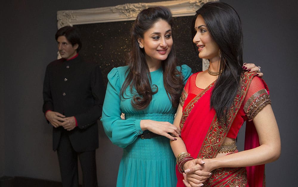 Bollywood star Kareena Kapoor comes faces to face with her wax figure from 2011 after donating a new red sari with a gold trim that the actress wore from the film 'Ra.One', at Madame Tussauds in central London.