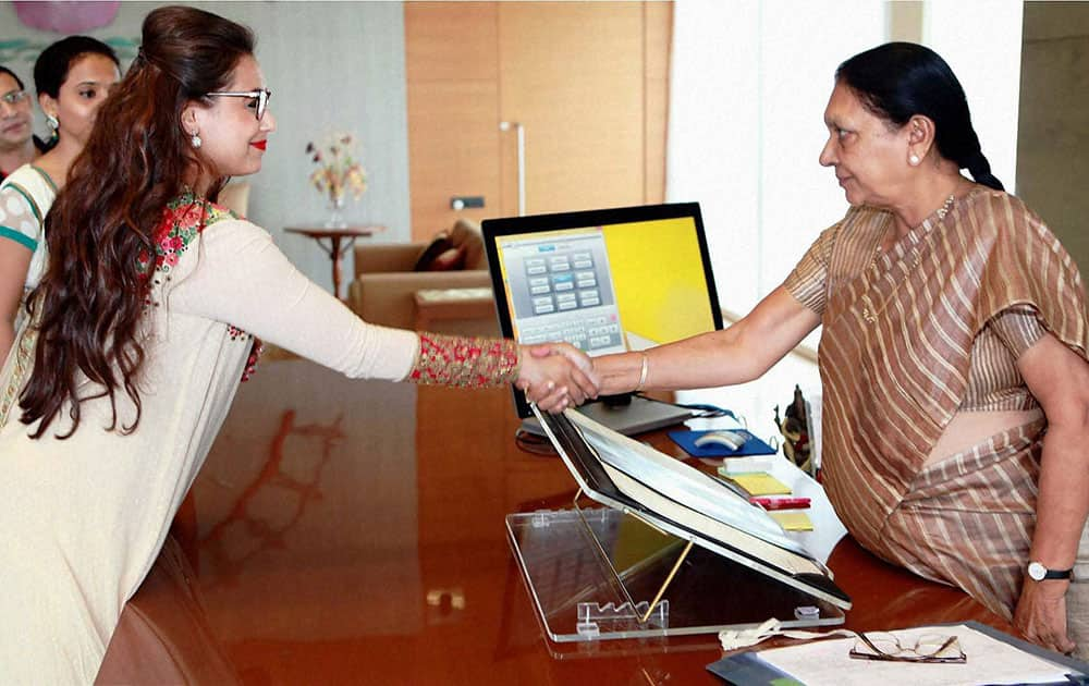 RANI MUKERJI greeting Gujarat Chief Minister Anandiben Patel at the Gujarat Secretariat in Gandhinagar.