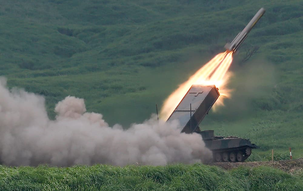 The Japan Ground Self-Defense Force`s anti-landmine missile is launched during an annual live firing exercise at Higashi Fuji range in Gotemba, southwest of Tokyo.