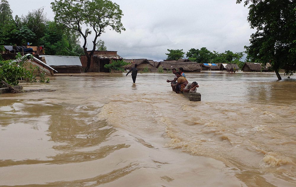 A view of a flooded road in Tikonia area near Indo-Nepal border in Lakhimpur Kheeri, Uttar Pradesh.