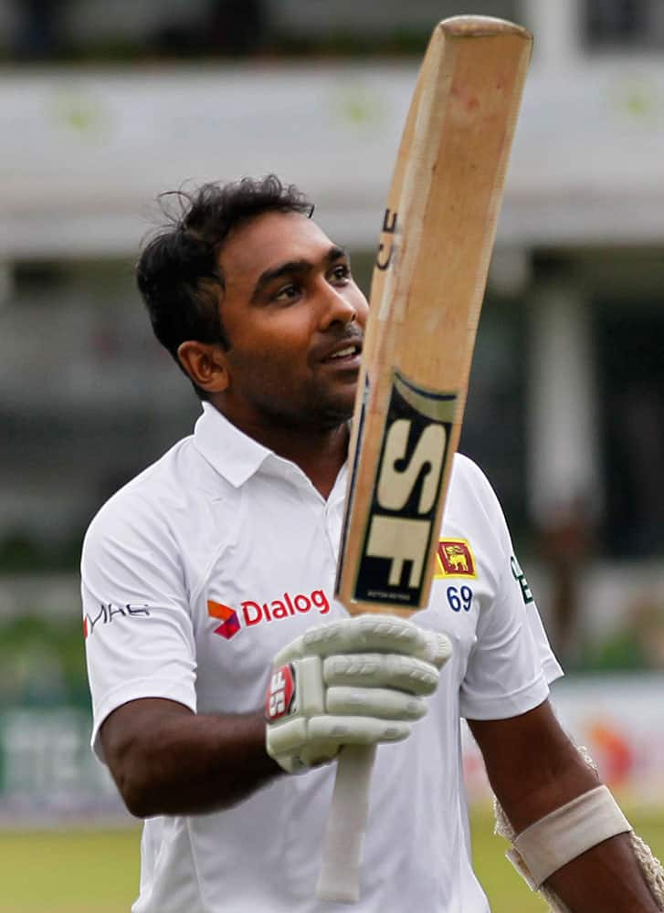 Sri Lankan batsman Mahela Jayawardene acknowledges the crowd as he leaves the pitch after being dismissed in his final test innings during the fourth day of the second test cricket match against Pakistan in Colombo, Sri Lanka.