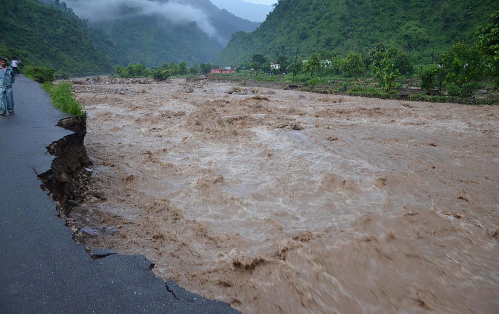 Damaged roads by overflowing Saung river at Tehri Garhwal area near Dehradun.