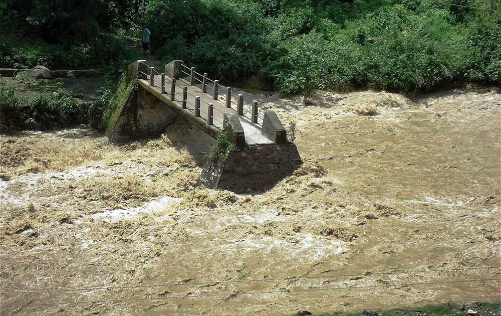  A view of a bridge which washed away after flood in Henwal river in Nagini, Tehri Gahrwal.