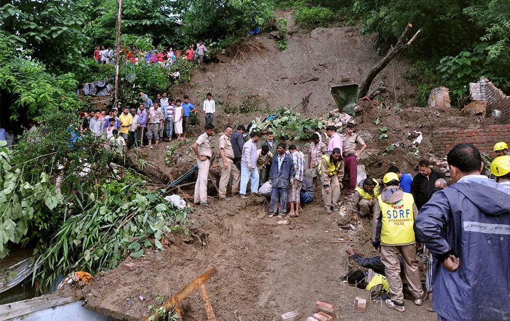 Rescue team busy in rescuing the people and dead bodies, where seven people died in a landslide at Rajpur area in Dehradun.