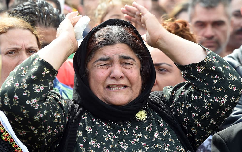 A woman shouts during a demonstration in Hannover, Germany. Thousands of people in Germany have protested against the persecution of the Yazidi minority in Iraq.