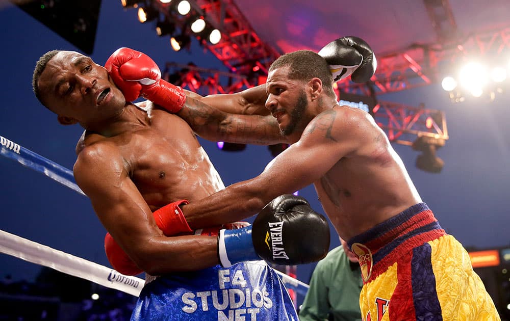 Sakio Bika, left, gets hit by Anthony Dirrell during their WBC super middleweight title boxing bout in Carson, Calif.