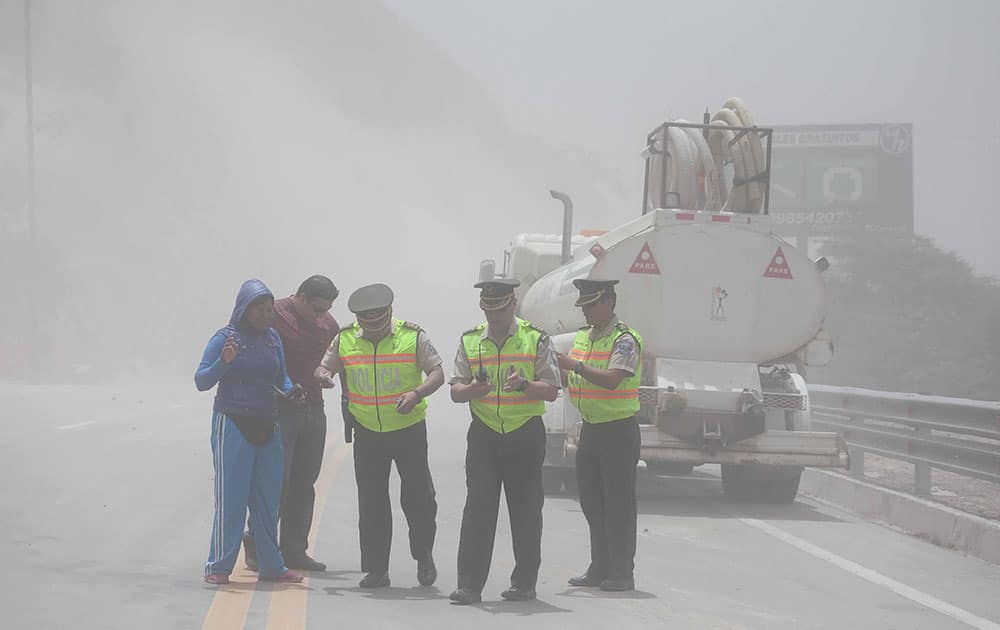 Police close traffic to the Pan-American highway as earth and dust spill on it from the hills above, after a quake struck Ecuador`s Capital. An earthquake measuring 4.7 degrees shook Quito on Saturday causing injuries and the temporary closure of the capital`s airport, according to authorities.