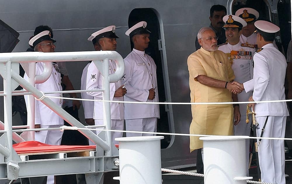 Prime Minister, Narendra Modi and Admiral RK Dhowan, Chief of Naval Staff along with other Naval officers during the commissioning ceremony of INS Kolkata (D63) the lead ship of the Kolkata-class guided-missile destroyers at the Naval Dockyard in Mumbai.