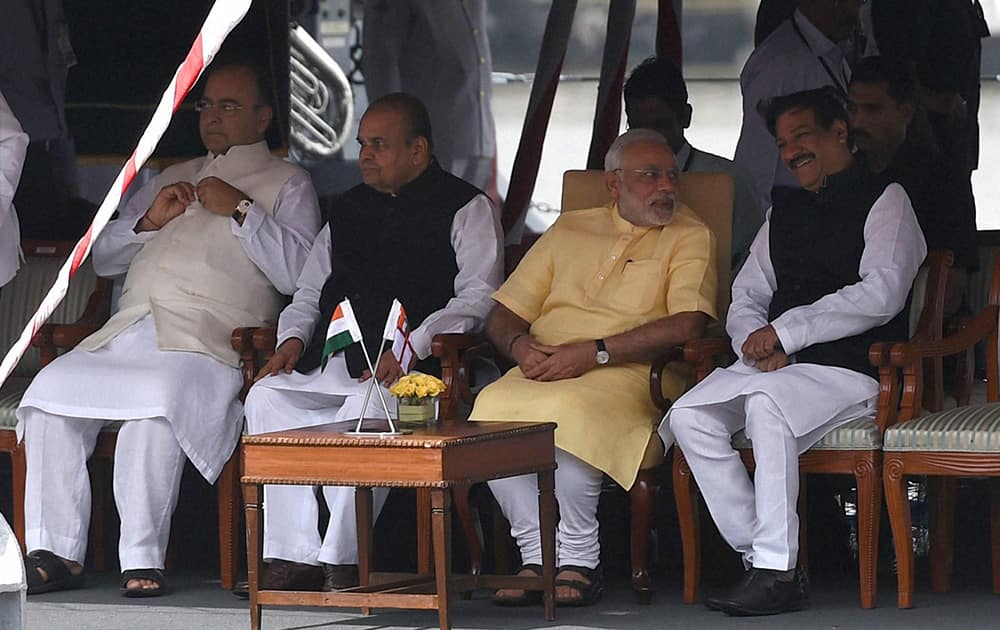 Prime Minister, Narendra Modi (3rd from right) flanked by Defence Minister, Arun Jaitley, Maharashtra Governor, K Shankarnarayanan and Maharashta Chief Minister Pritviraj Chavan during the commissioning ceremony of INS Kolkata (D63) the lead ship of the Kolkata-class guided-missile destroyers at the Naval Dockyard in Mumbai.