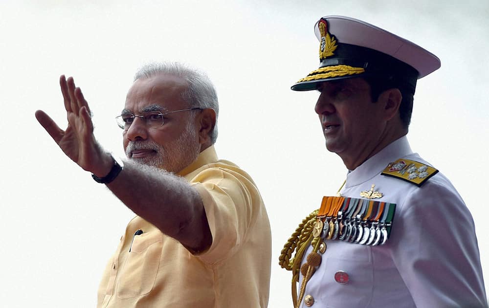 Prime Minister, Narendra Modi along with Admiral RK Dhowan, Chief of Naval Staff during the commissioning ceremony of INS Kolkata (D63), the lead ship of the Kolkata-class guided-missile destroyers at the Naval Dockyard in Mumbai.