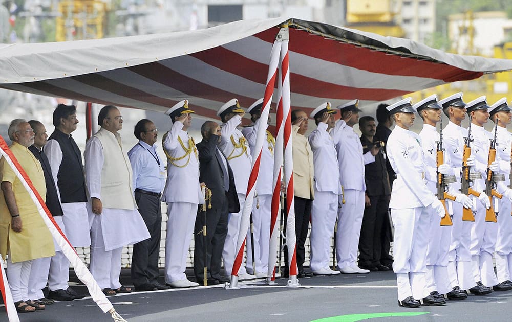 Prime Minister, Narendra Modi along with Maharashtra Governor K Shankarnarayanan, Maharashtra CM Prithviraj Chavan, Union Defence Minister, Arun Jaitley and Admiral RK Dhowan, Chief of Naval Staff during the commissioning ceremony of INS Kolkata (D63), the lead ship of the Kolkata-class guided-missile destroyers at the Naval Dockyard in Mumbai.