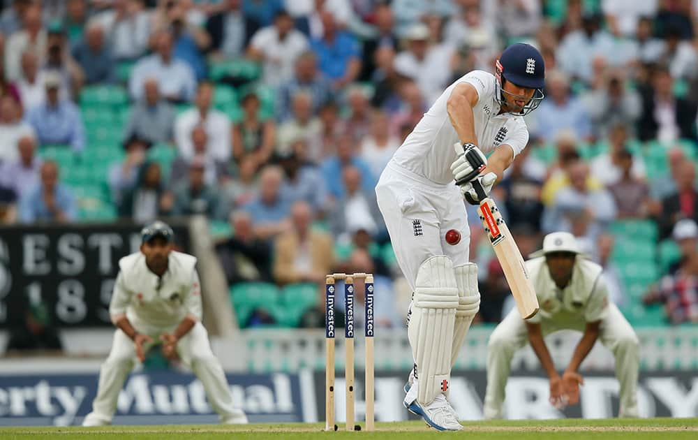 England's Alastair Cook is hit by a ball bowled by India's Ishant Sharma during the first day of the fifth test cricket match at Oval cricket ground in London.