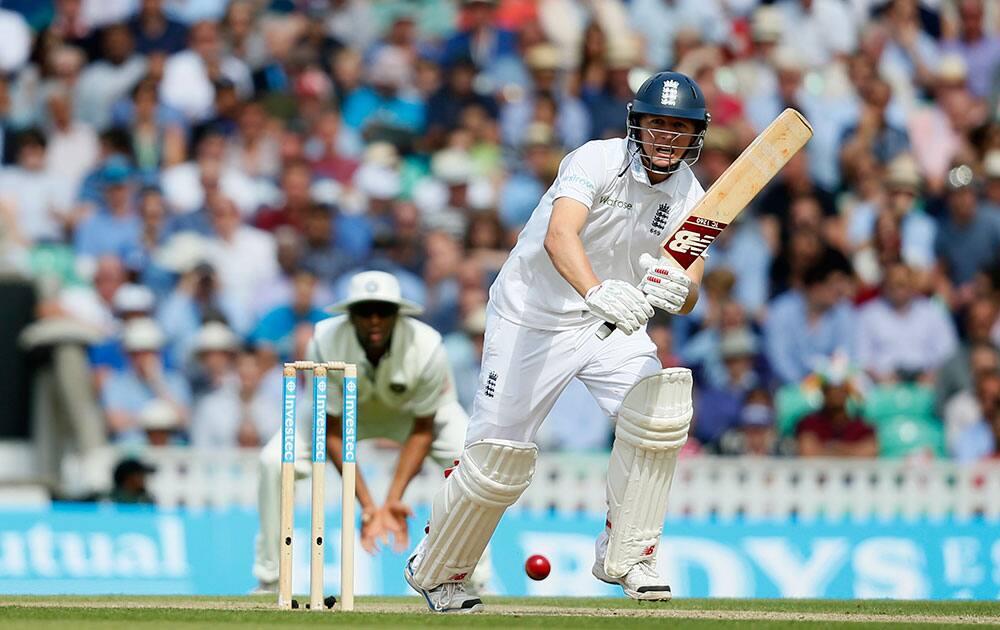 England's Gary Ballance hits four runs off the bowling of India's Bhuvneshwar Kumar during the second day of the fifth test cricket match at Oval cricket ground in London.