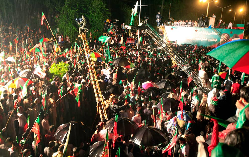 Supporters of Pakistan`s cricketer-turned-politician Imran Khan take part in an anti government rally in Islamabad, Pakistan