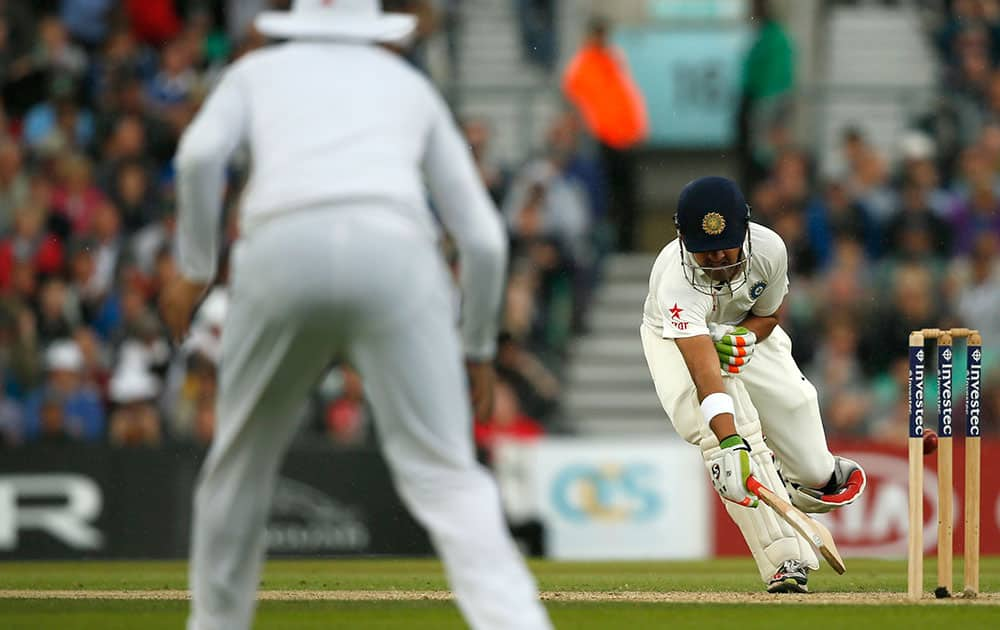 India's Gautam Gambhir is run out from a throw by England's Chris Woakes during the third day of the fifth test cricket match at Oval cricket ground in London.