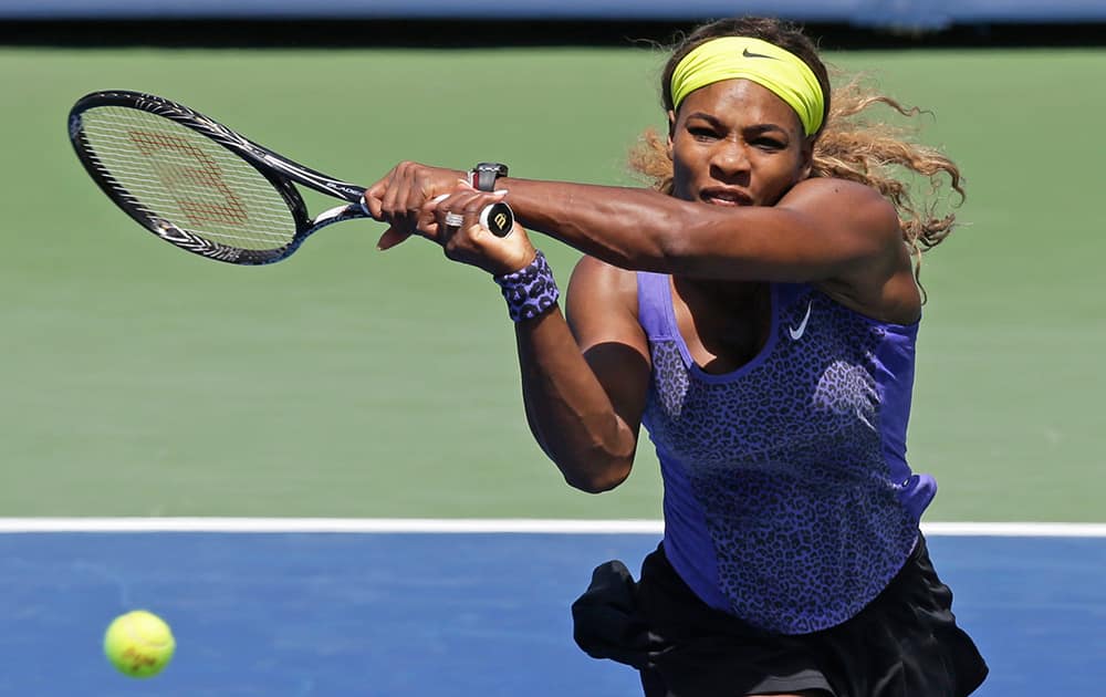 Serena Williams volleys against Jelena Jankovic, from Serbia, during a match at the Western & Southern Open tennis tournament.