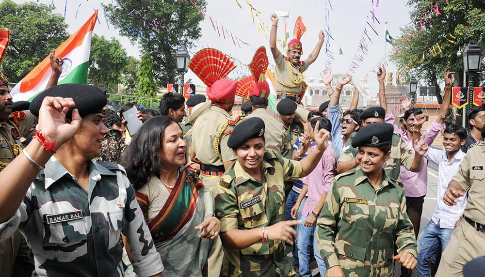 BSF personnel along with others dancing to celebrate Independence Day at the Indo-Pakistani joint check post at Attari..