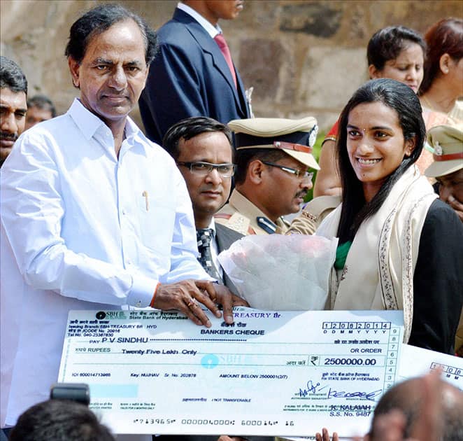 Telangana Chief Minister K Chandrashekar Rao felicitating shuttler PV Sindhu during the 68th Independence Day function at the historic Golkonda Fort in Hyderabad.