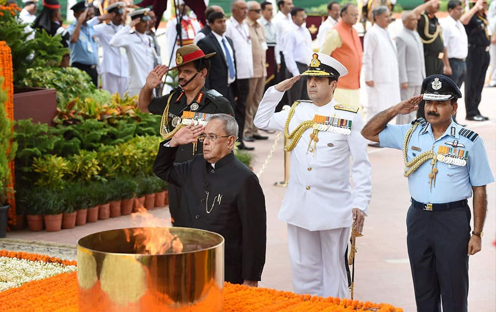 President Pranab Mukherjee paying homage at Amar Jawan Jyoti during the 68th Independence Day celebration at India Gate in New Delhi. Air Chief Marshal Arup Raha, Navy Chief Admiral RK Dhowan and Army chief Gen Dalbir Singh Suhag are also seen.