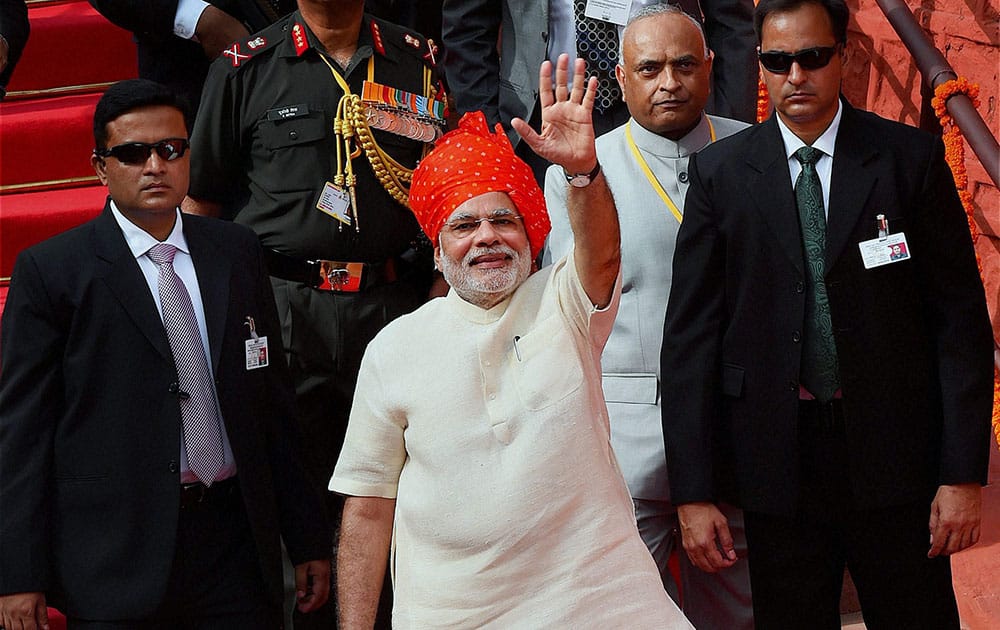 Prime Minister Narendra Modi waves after addressing the nation on the 68th Independence Day from the historic Red Fort in New Delhi.