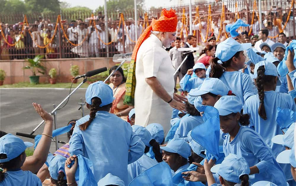 Prime Minister Narendra Modi interacts with school children after addressing the Nation from rampart of the historic Red Fort during the 68th Independence Day function, in New Delhi.