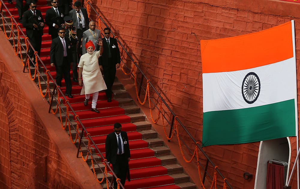 Narendra Modi waves to the media as he leaves after addressing the nation from the ramparts of the historical Red Fort to celebrate Independence Day in New Delhi.