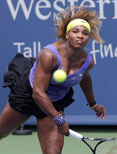 Serena Williams serves against Flavia Pennetta, from Italy, during a match at the Western & Southern Open tennis tournament.