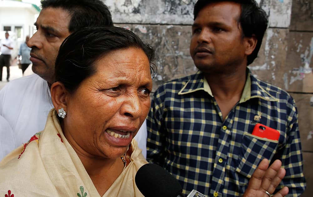 Rukmani Devi, sister of India’s famous “Bandit Queen” Phoolan Devi speaks to the media outside a court after judgment was passed in the murder case, in New Delhi.