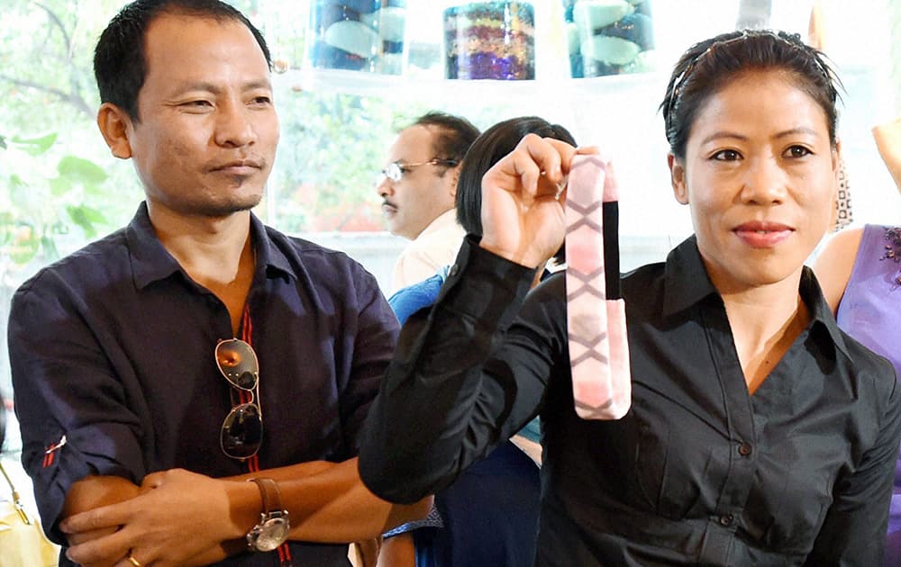 Boxer Mary Kom with husband Onler Karong during a promotional event in Mumbai.