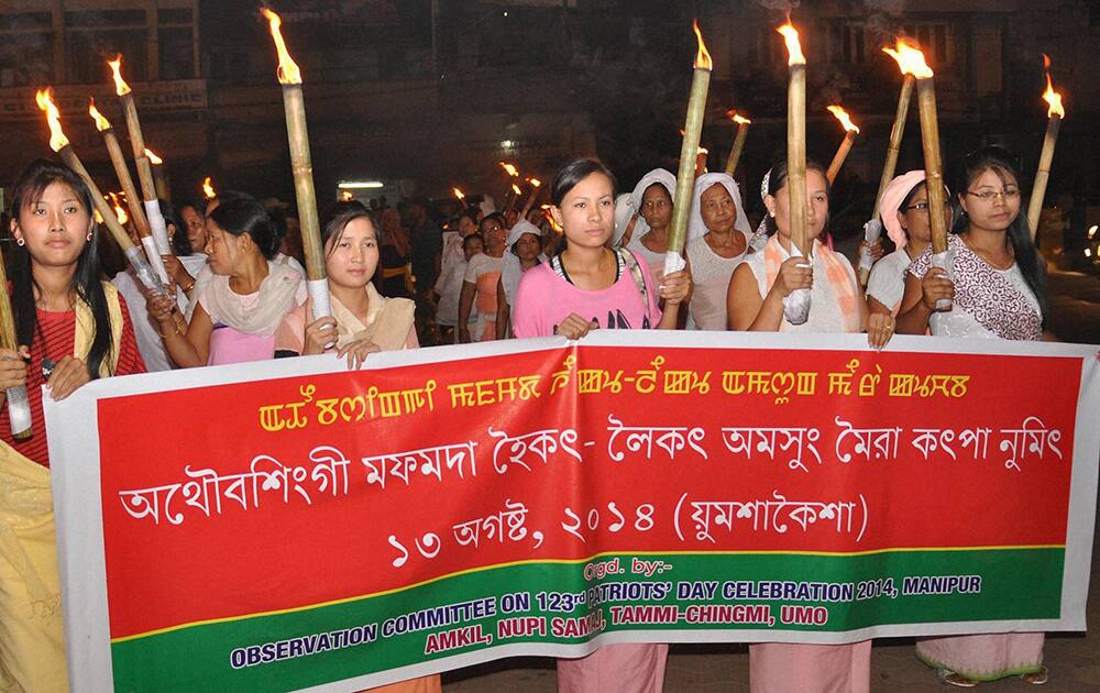 Meira Paibis of Manipur arrive to observing Patriots Day in Imphal on Wednesday in memory of General Thangal and Bir Tikendrajit who were hanged after Manipur lost its last battle against British government.