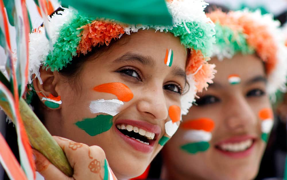 Schoolgirls dressed in the colors of the Indian national tricolor flag participate in rehearsals for Independence Day celebrations in Ajmer.